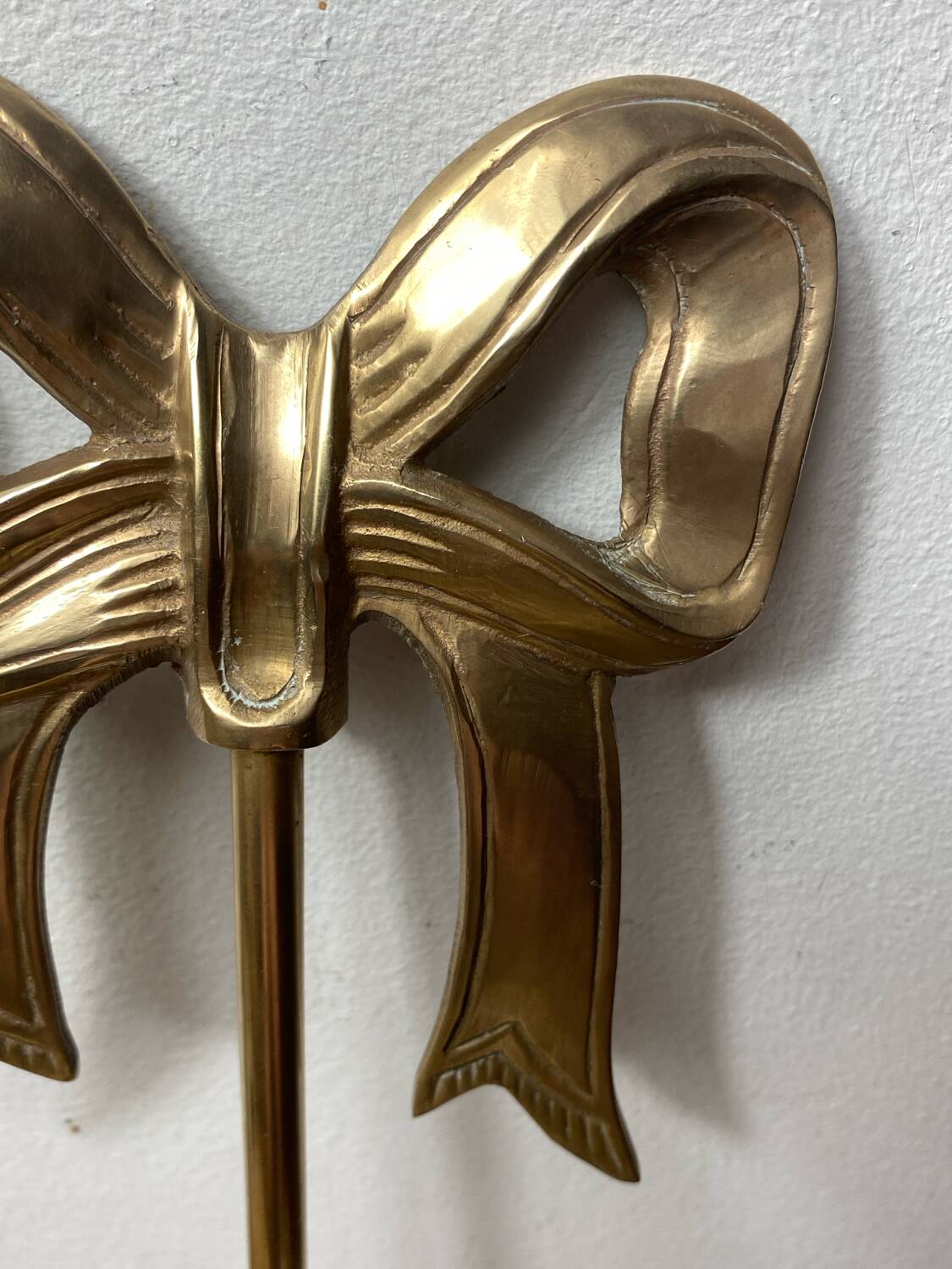 Solid brass bow and ribbon wall candle holder
