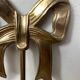 Solid brass bow and ribbon wall candle holder