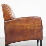 Art Deco design sheepskin leather armchair with a stunning patina