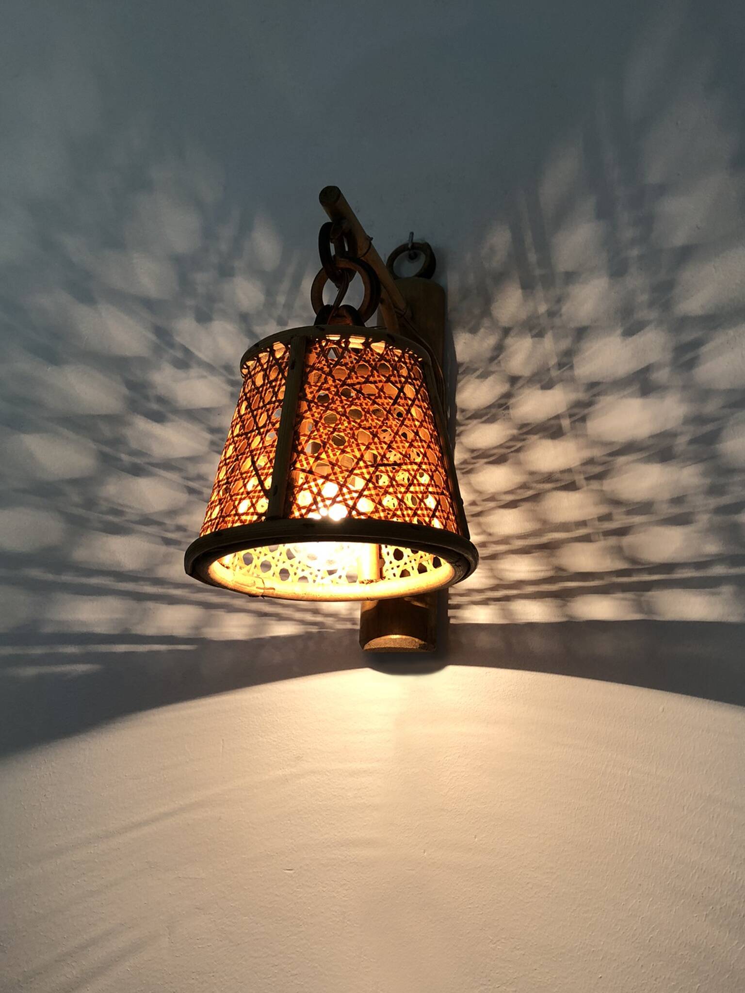 Pair of rattan and cane lantern wall lights. 1950s-60s