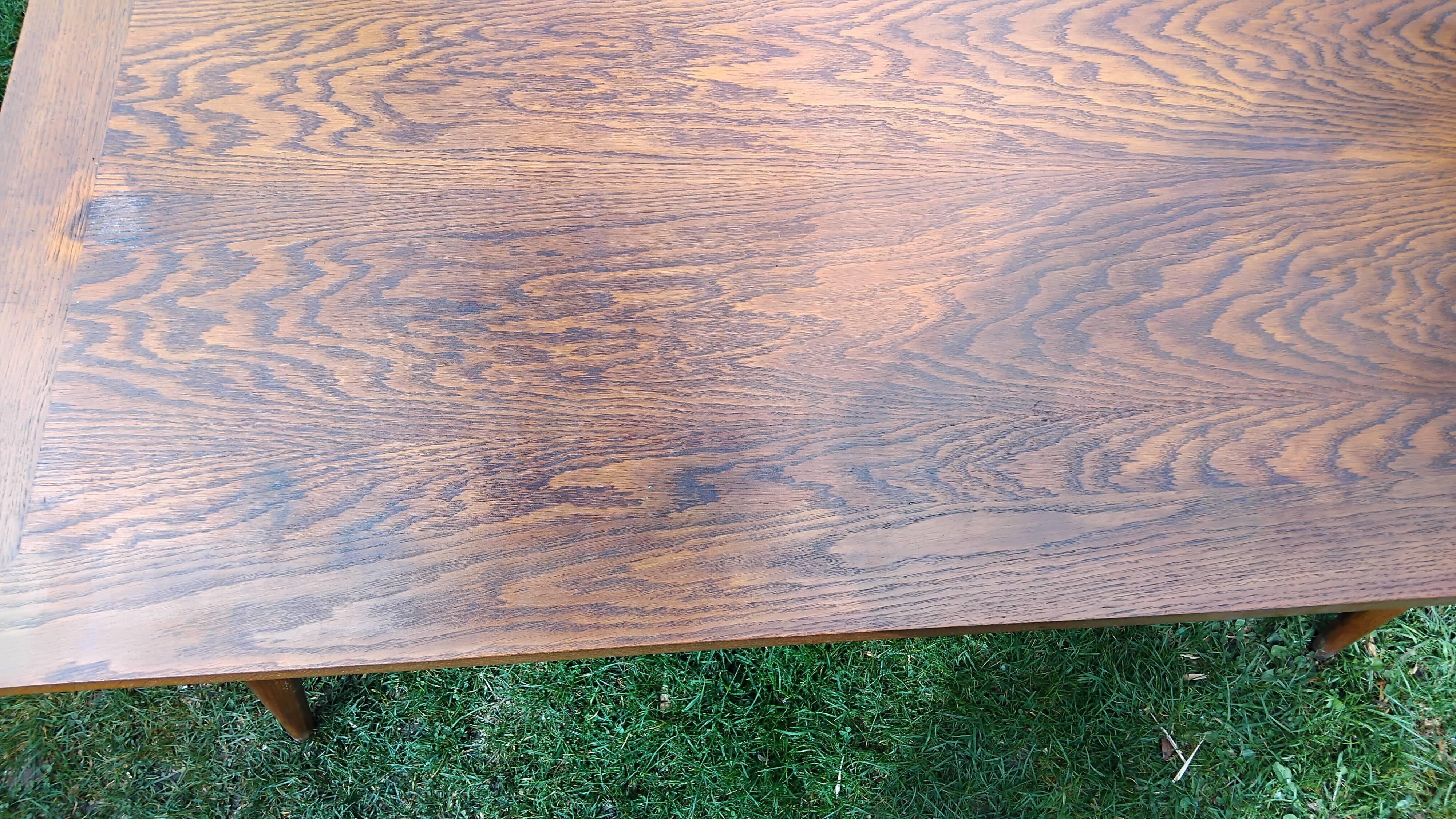 Vintage oak table with tapered legs.