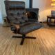Vintage leather armchair with wooden armrests