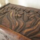 Coffre en bois sculpté bas reliefs artisanal XXème