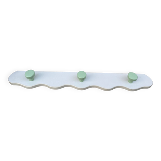 White and green wavy wooden coat rack