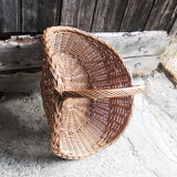 Old basket with logs in light wicker