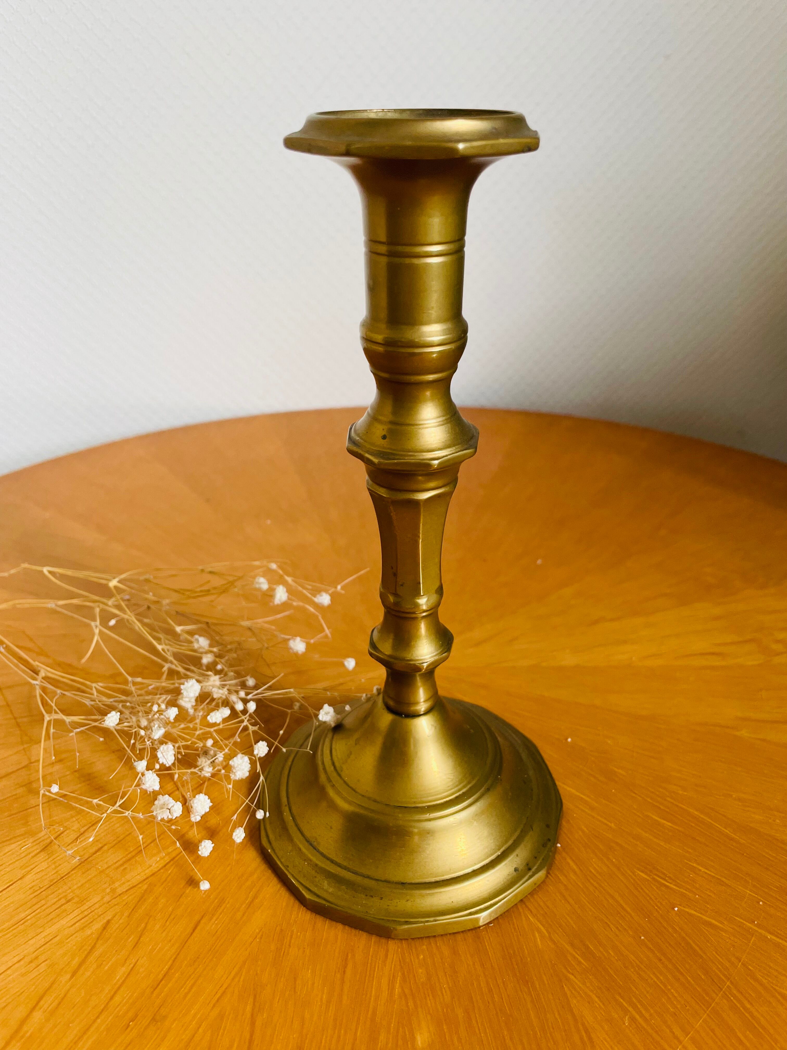 Old brass torch candle holder