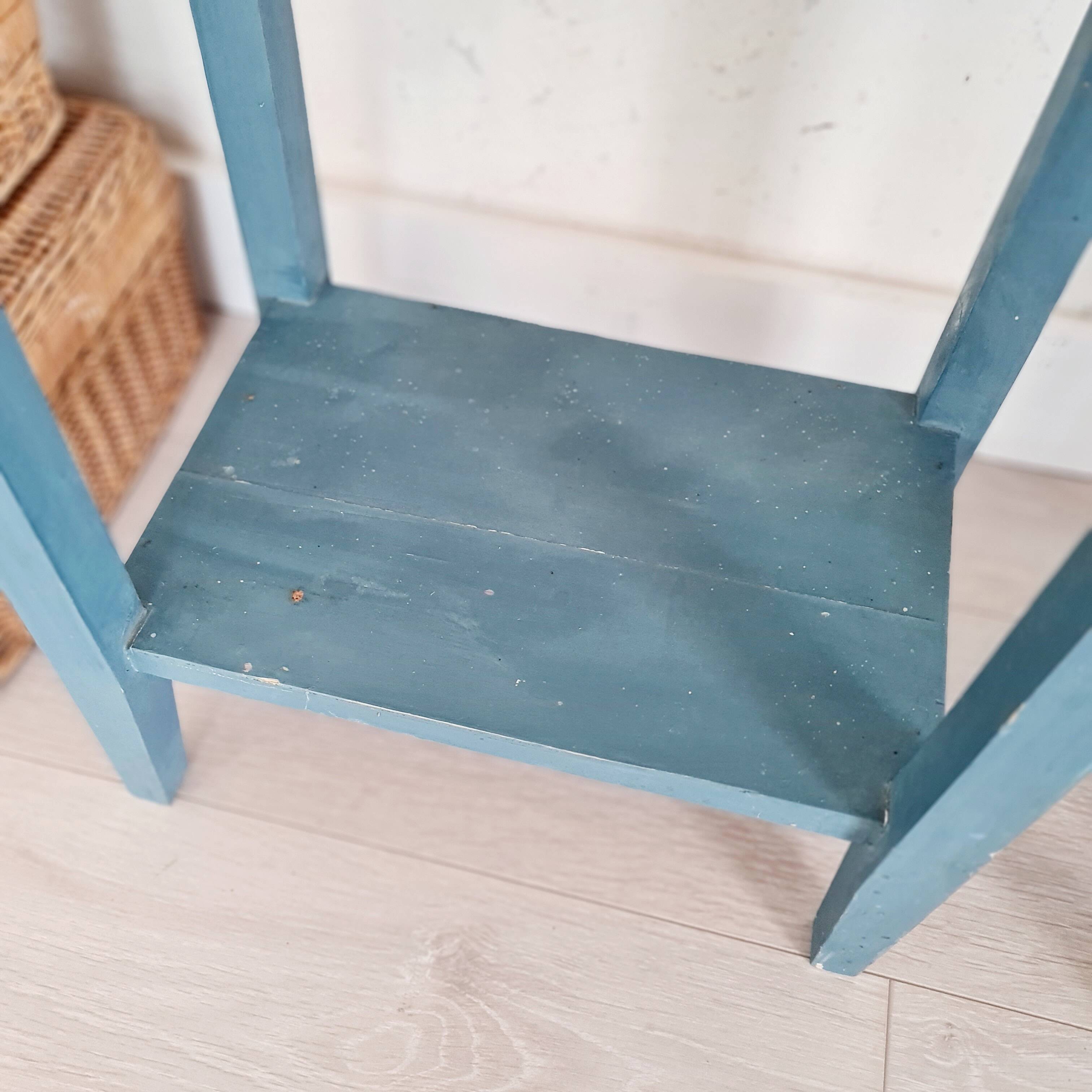 Blue wooden bedside tables with floral patterns