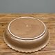 A trompe l’oeil strawberry pie dish