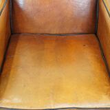 Sheep leather and wooden Art Deco design armchair with ball feet
