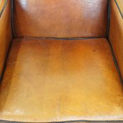 Sheep leather and wooden Art Deco design armchair with ball feet
