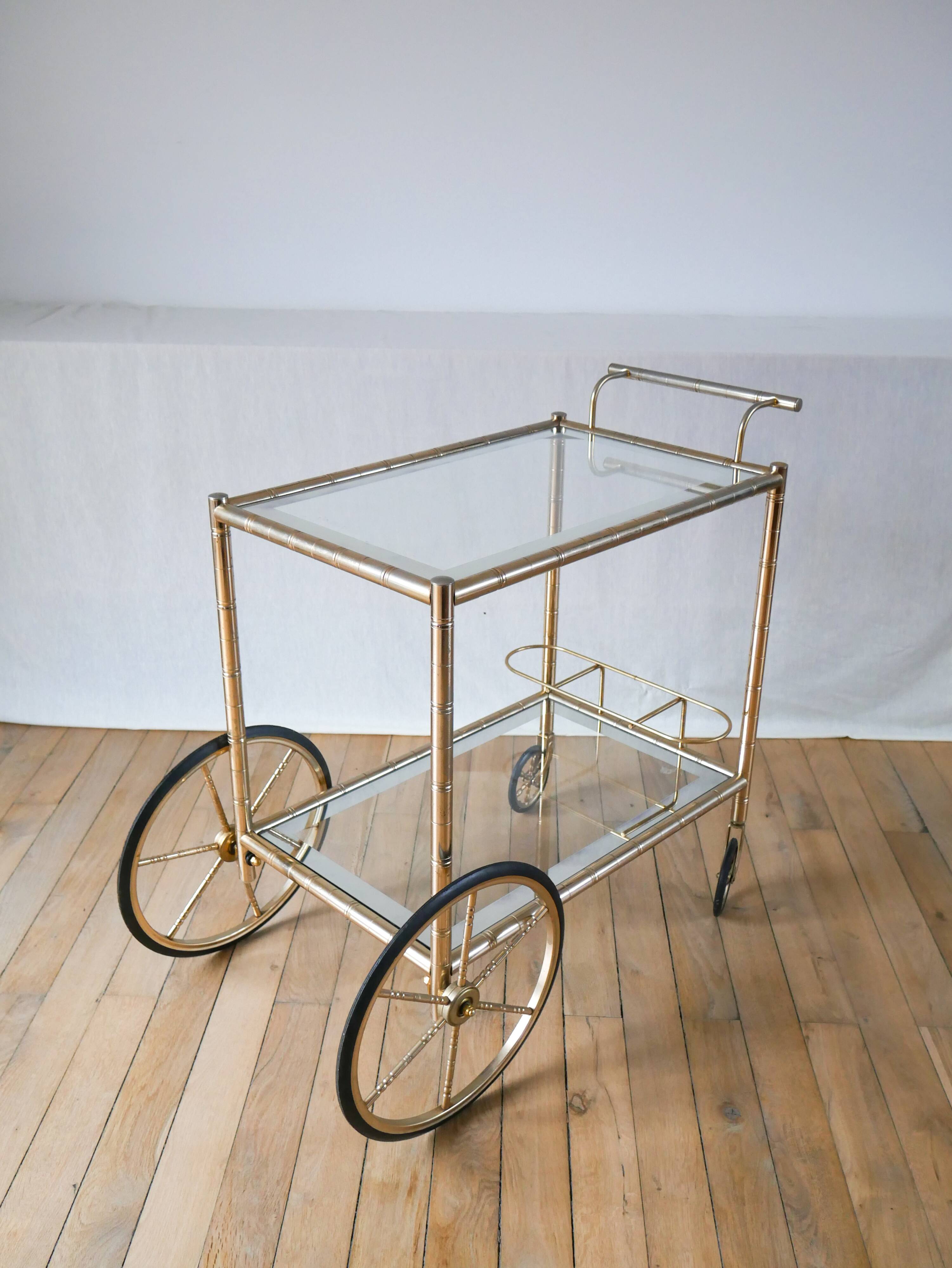Serving table in gilded metal and glass with large wheels 1950