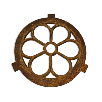 Cast iron ox's eye window in the shape of a flower
