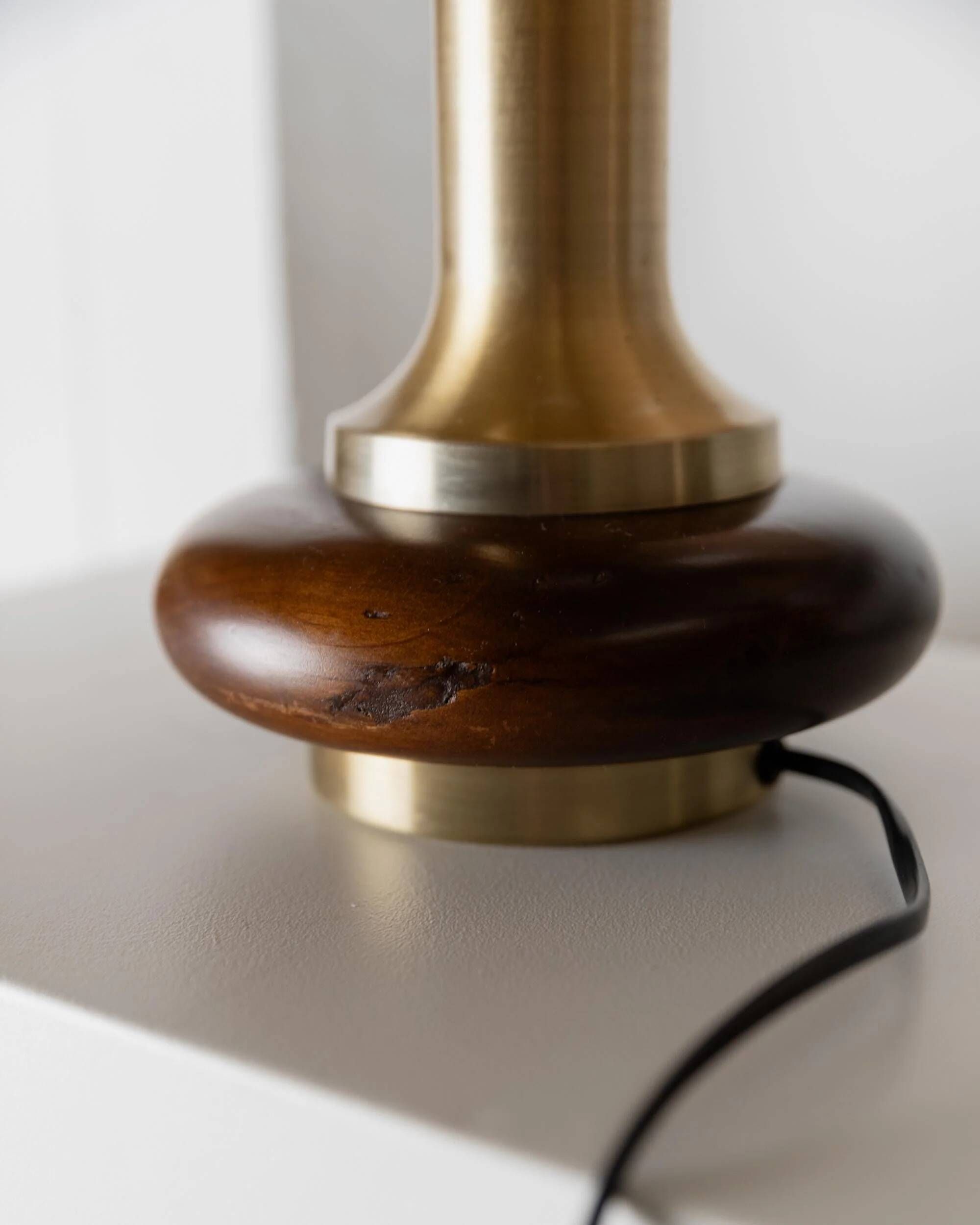Lot of 2 vintage table lamps from the 1970s, dark wood oval bases with curved brass details, handmade natural fibre lampshades, elegant lighting.