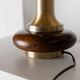 Lot of 2 vintage table lamps from the 1970s, dark wood oval bases with curved brass details, handmade natural fibre lampshades, elegant lighting.