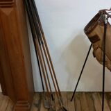 Old golf bag with 5 golf clubs