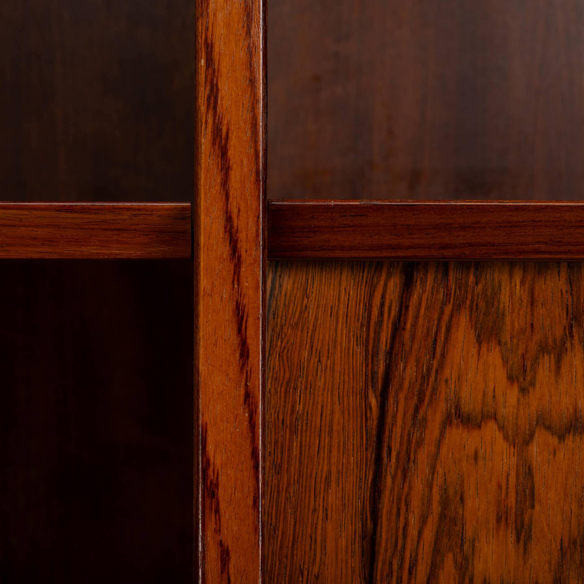 Rosewood library designed by Danish designers with doors by Hundevad & Co, 1960s.