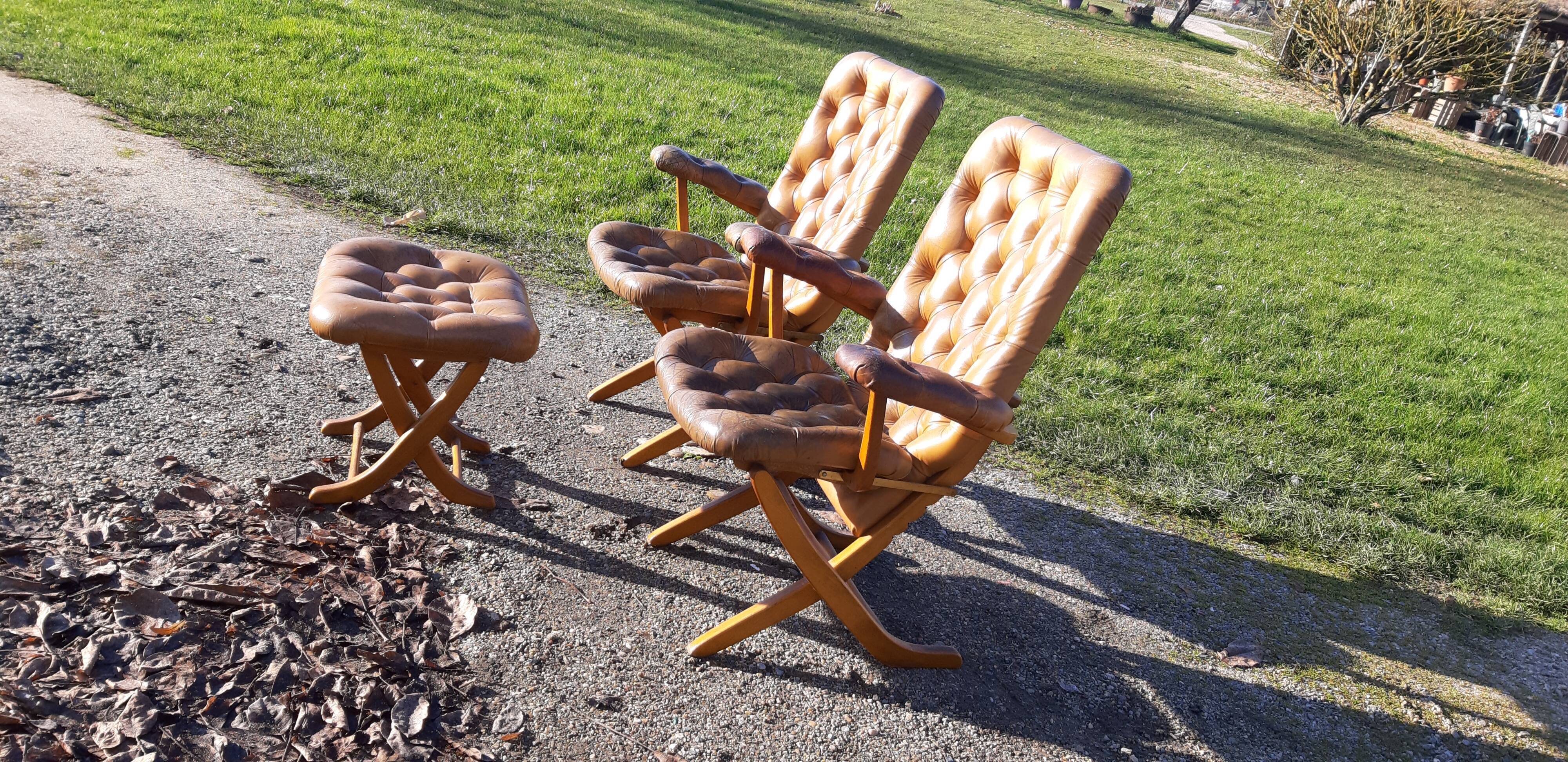 Pair of chesterfield style leather armchairs