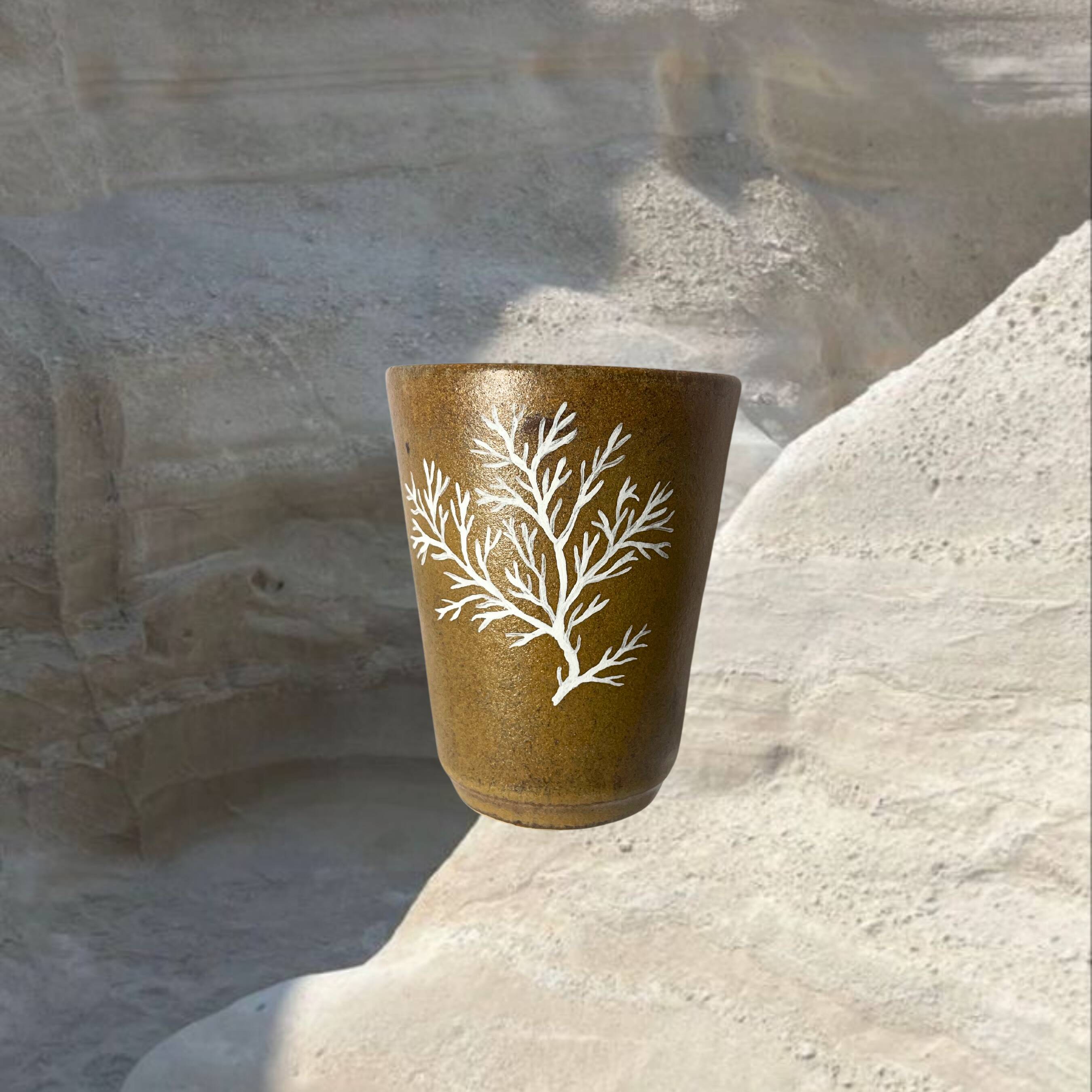 Stoneware cup with coral design