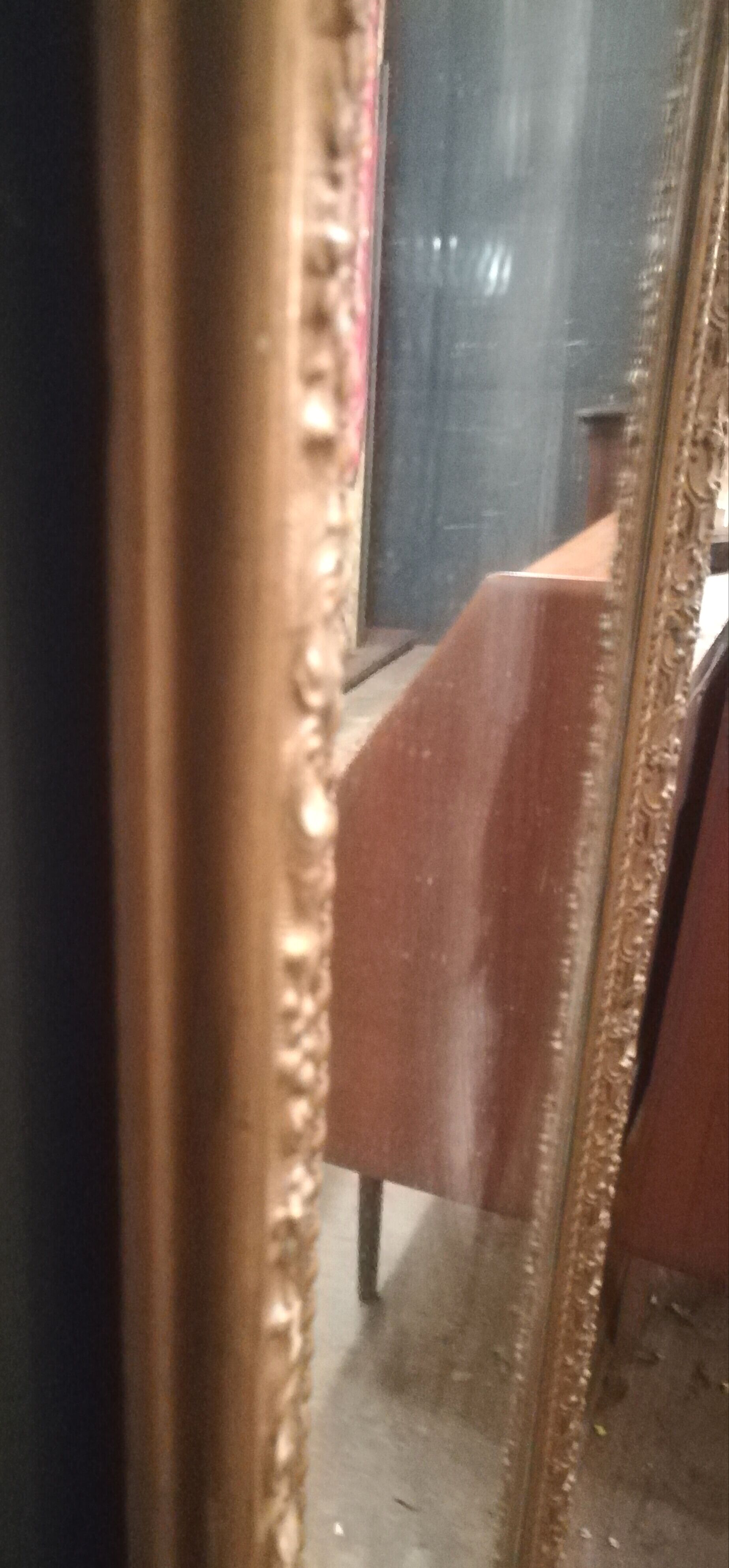 High and narrow mirror in gilded stucco late nineteenth century