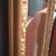High and narrow mirror in gilded stucco late nineteenth century