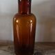 Vase flacon en verre ambré
