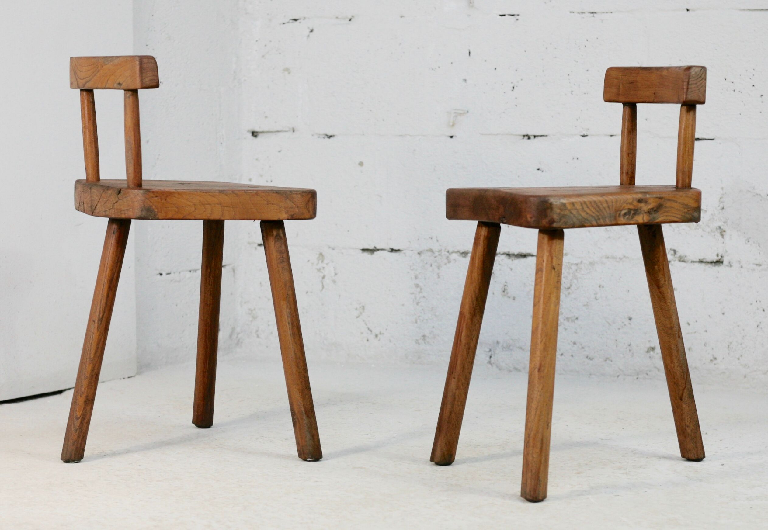 Pair of tripod stools with brutalist backrests, France, circa 1960