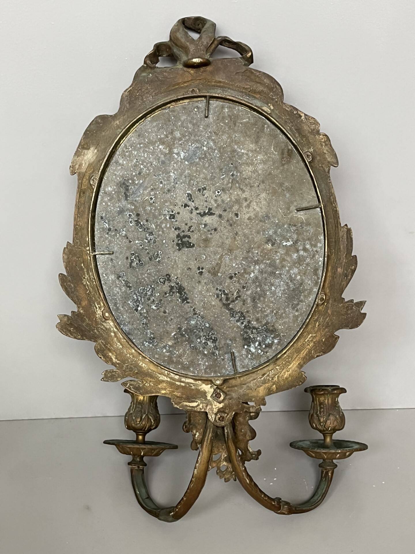 Pair of mirror sconces with bronze candlesticks from the 19th century.