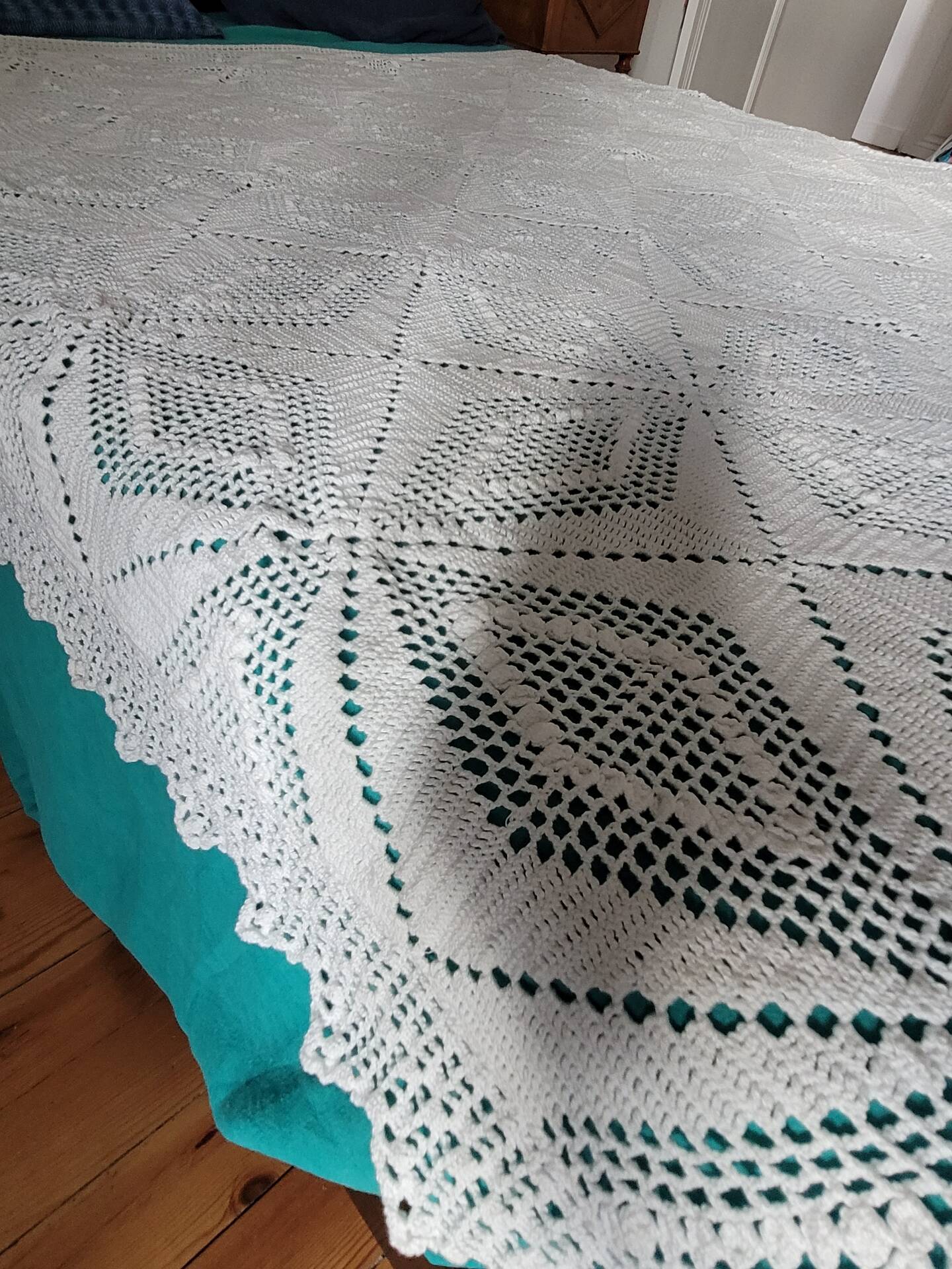 Large white crocheted bedspread