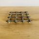 Silver metal table mat imitating bamboo