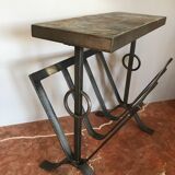 Iron and stone brutalist magazine rack