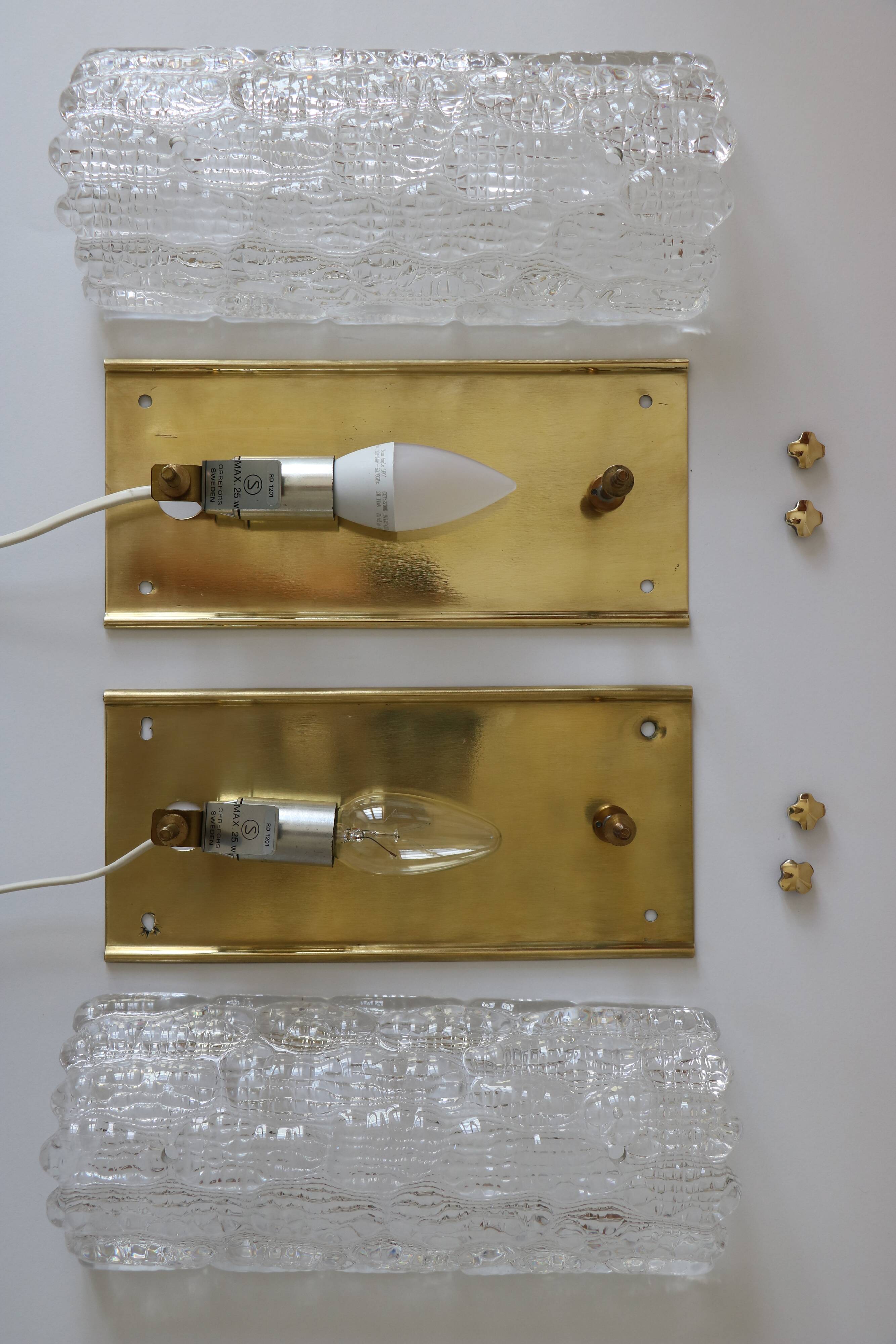 Pair of glass and brass wall lights by Carl Fagerlund for Orrefors.