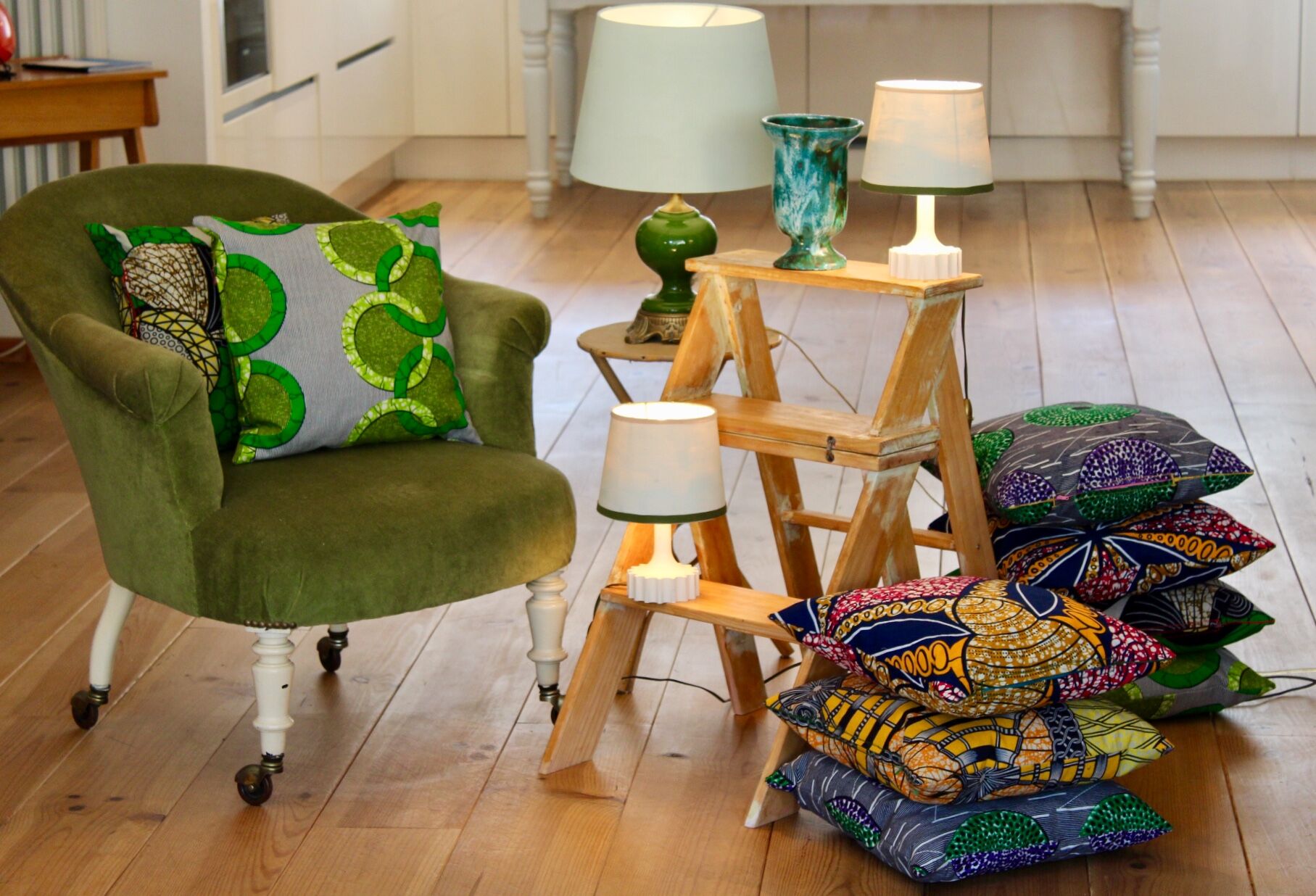 Toad in almond green velvet armchair on castors