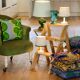 Toad in almond green velvet armchair on castors