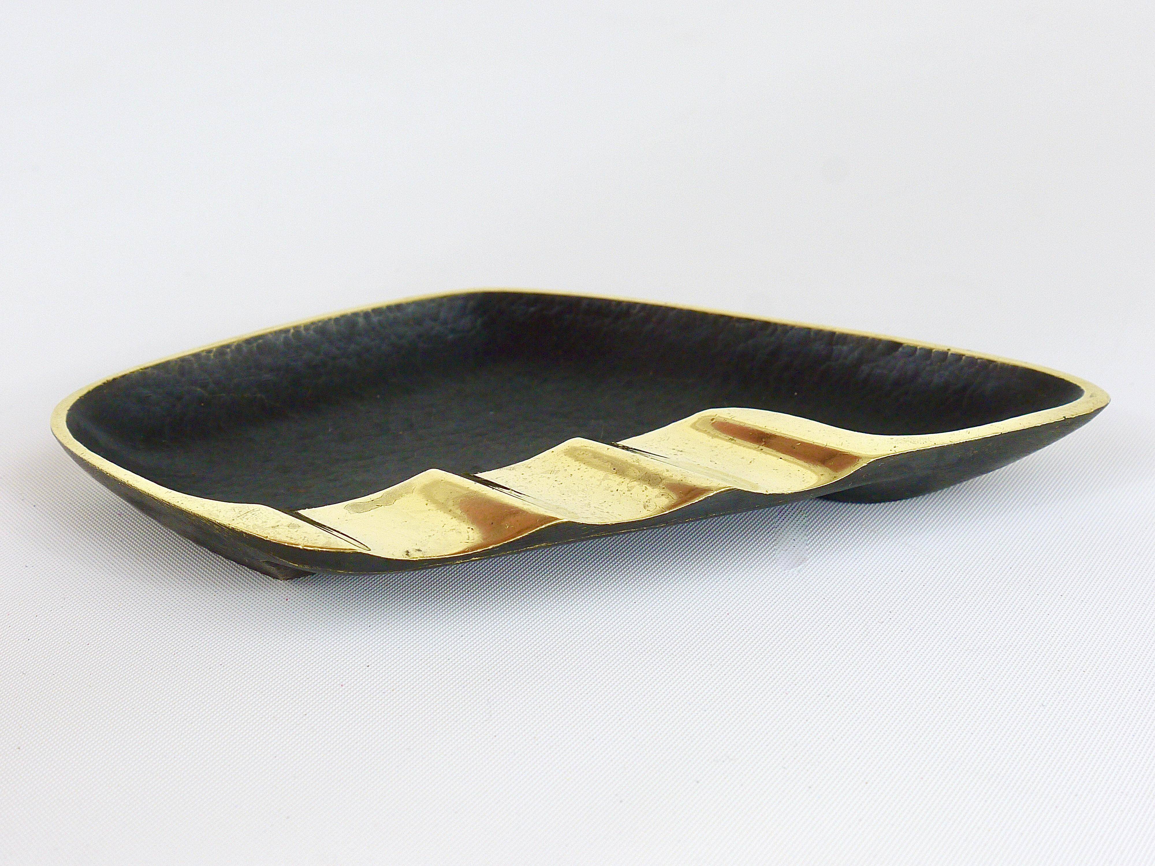 Asymmetrical modernist ashtray by Walter Bosse in black brass by Herta Baller, 1950s.