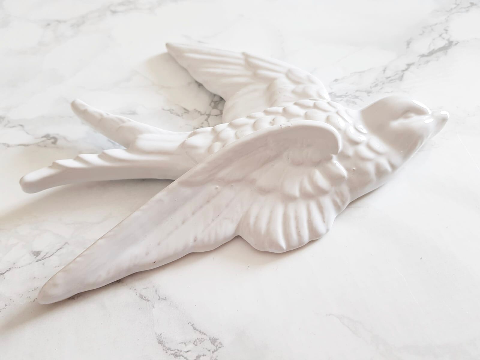 Set of three swallows in white earthenware