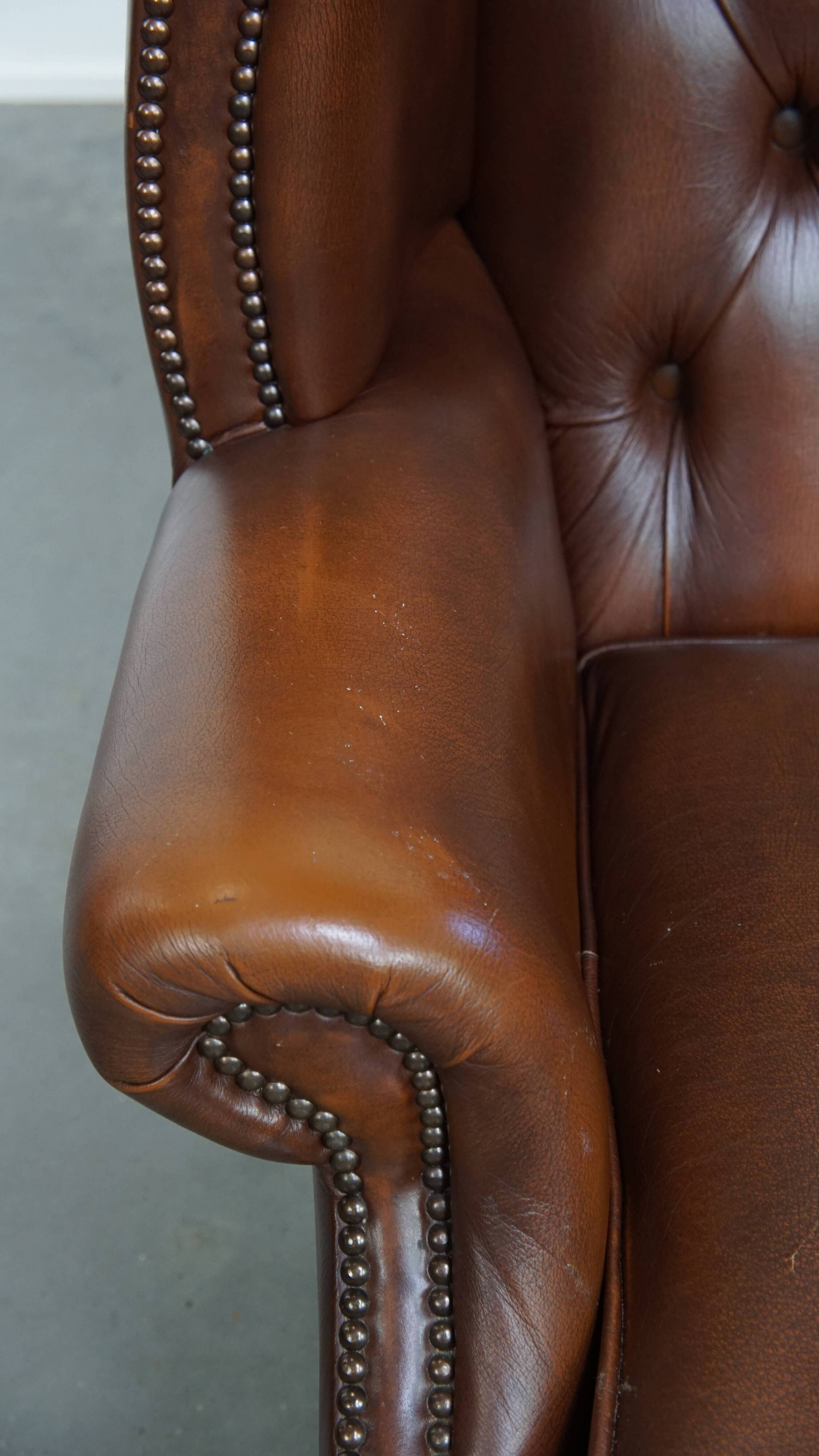Chesterfield wing chair in dark brown English cowhide