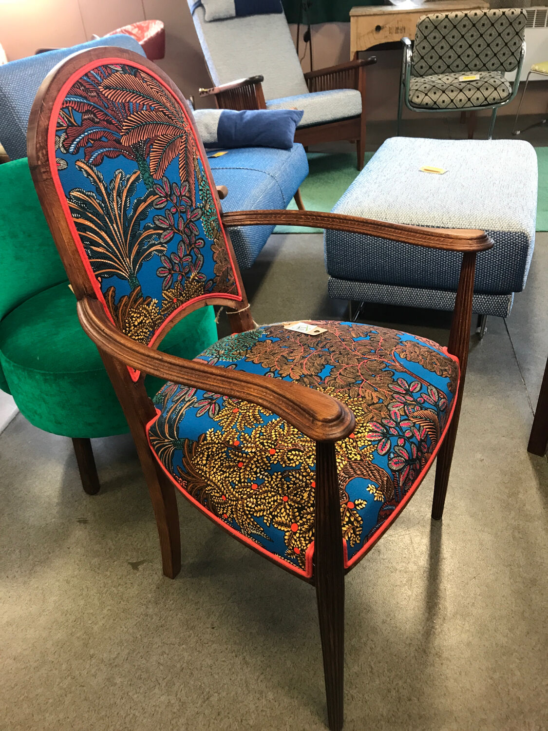 Art Nouveau armchair with a floral seat and backrest.