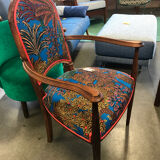 Art Nouveau armchair with a floral seat and backrest.