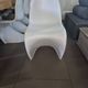 10 white chairs in the style of Verner Panton