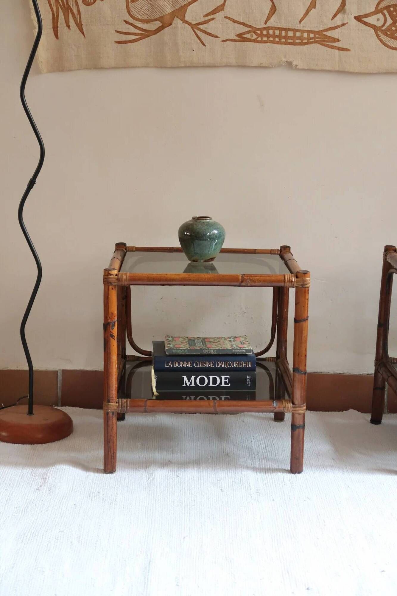 Pair of bamboo and rattan bedside tables, smoked glass tops.