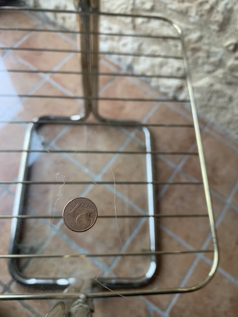 Glass and brass side table with magazine rack, circa 1970's