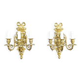 Pair of antique bronze wall sconces from the Napoleonic III era in the Louis XVI style.