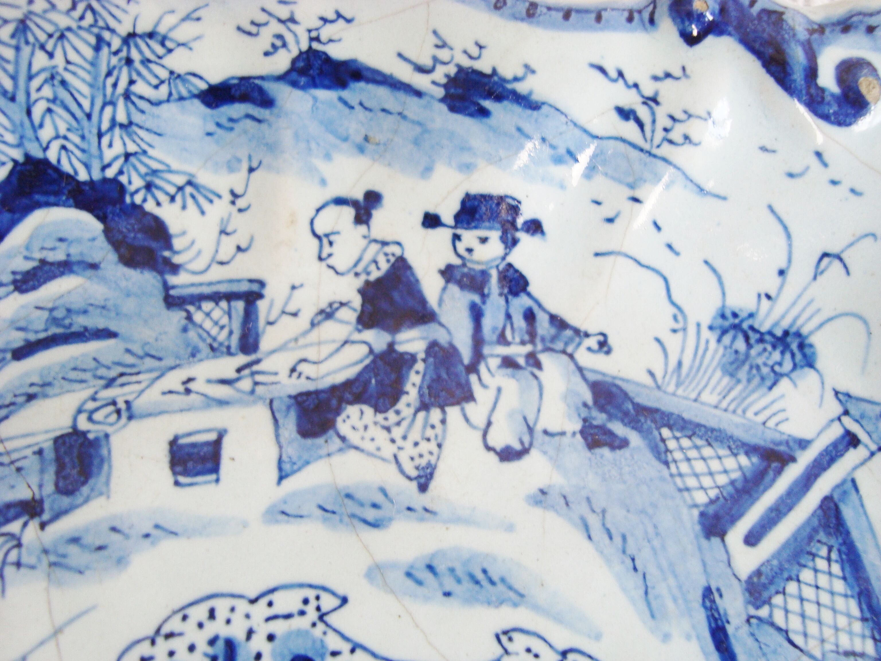 Old blue and white Delft decorative plate with Chinese motifs