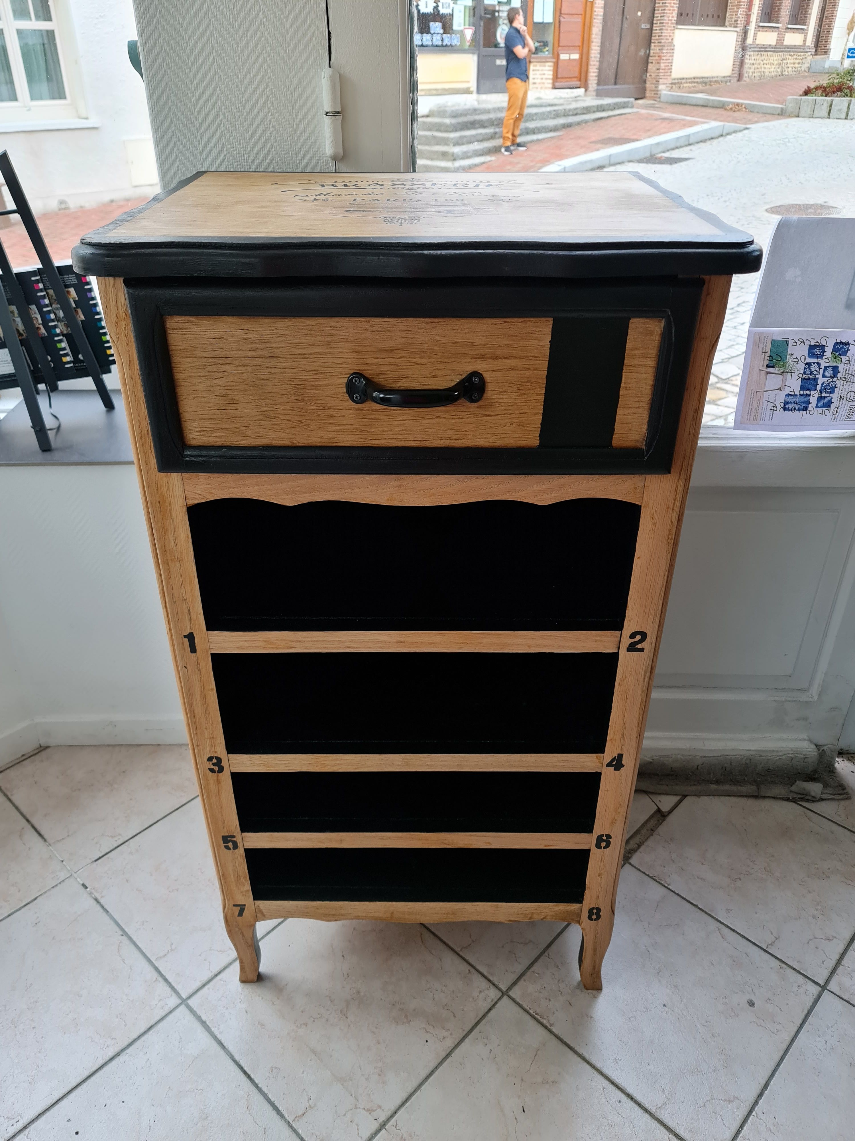 Raw oak and matte black storage cabinet on stencil top and transfer