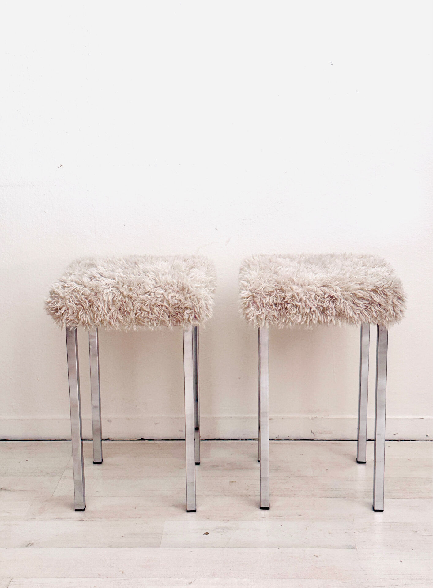 Set of two vintage chrome stools with fluffy upholstery