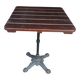 Bistro table with a cast iron base and a wooden top.