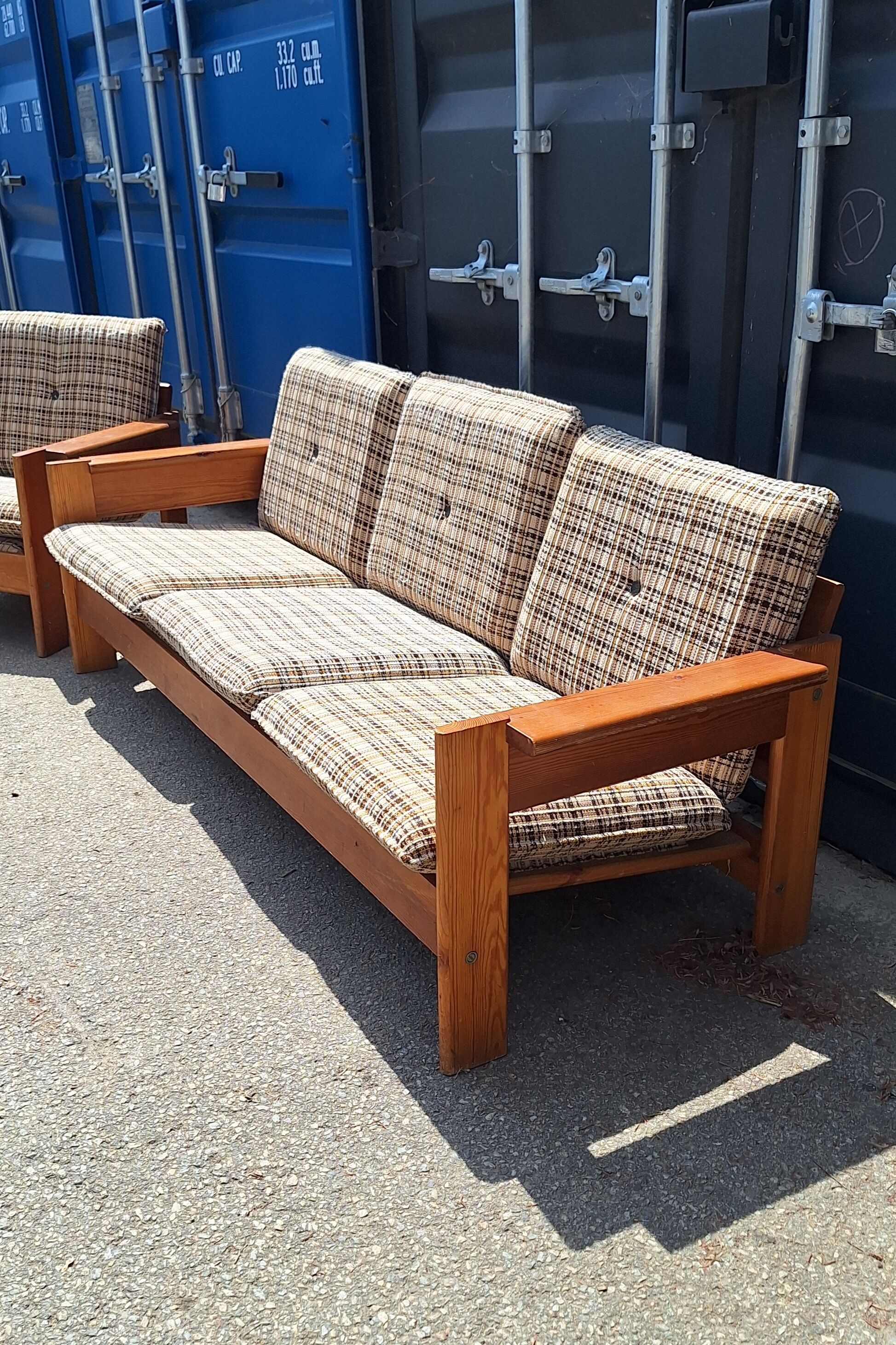 Brutalist-style bench and armchairs in 1970s pine.