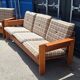 Brutalist-style bench and armchairs in 1970s pine.