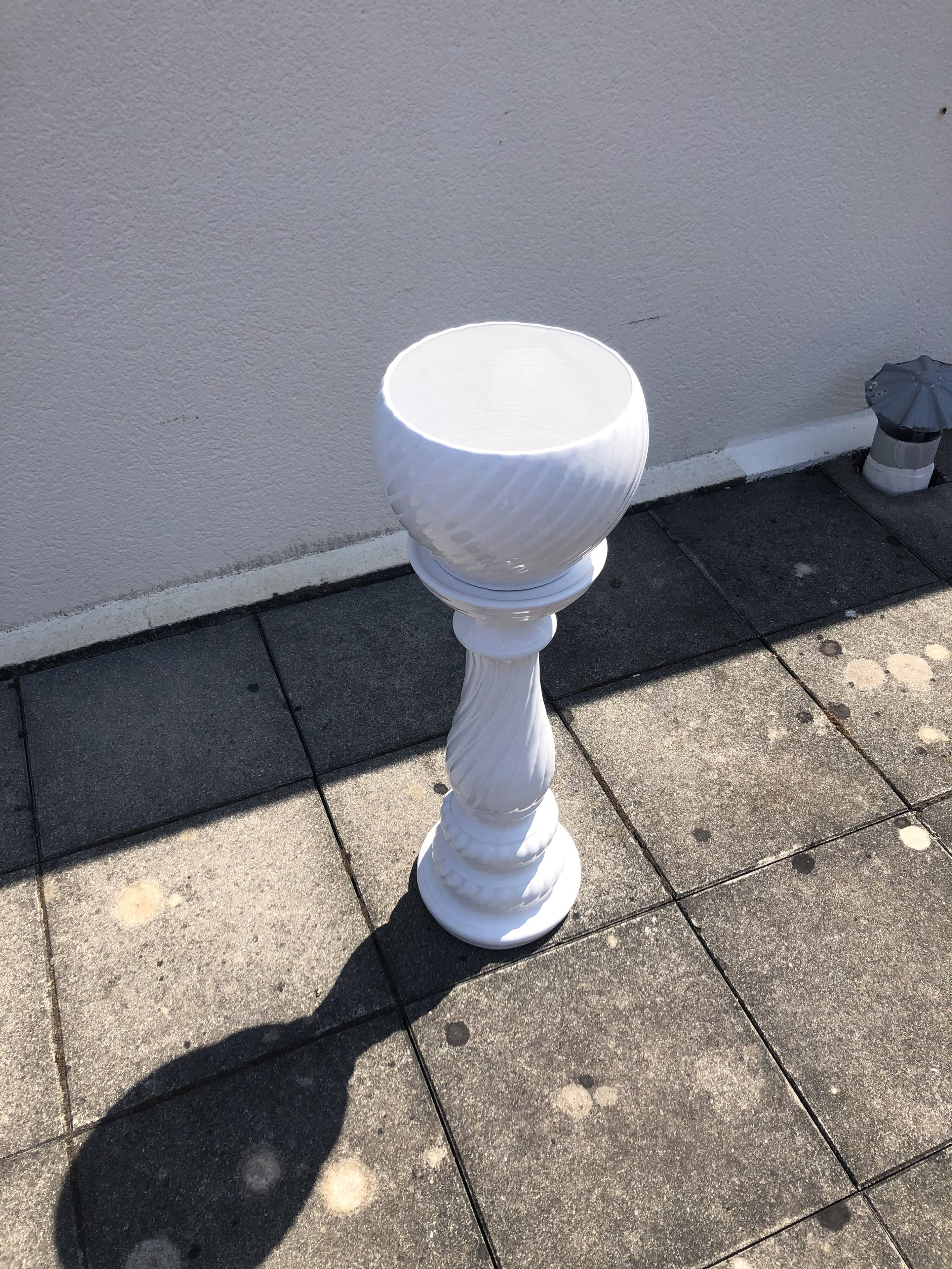 Column and white earthenware pot cover