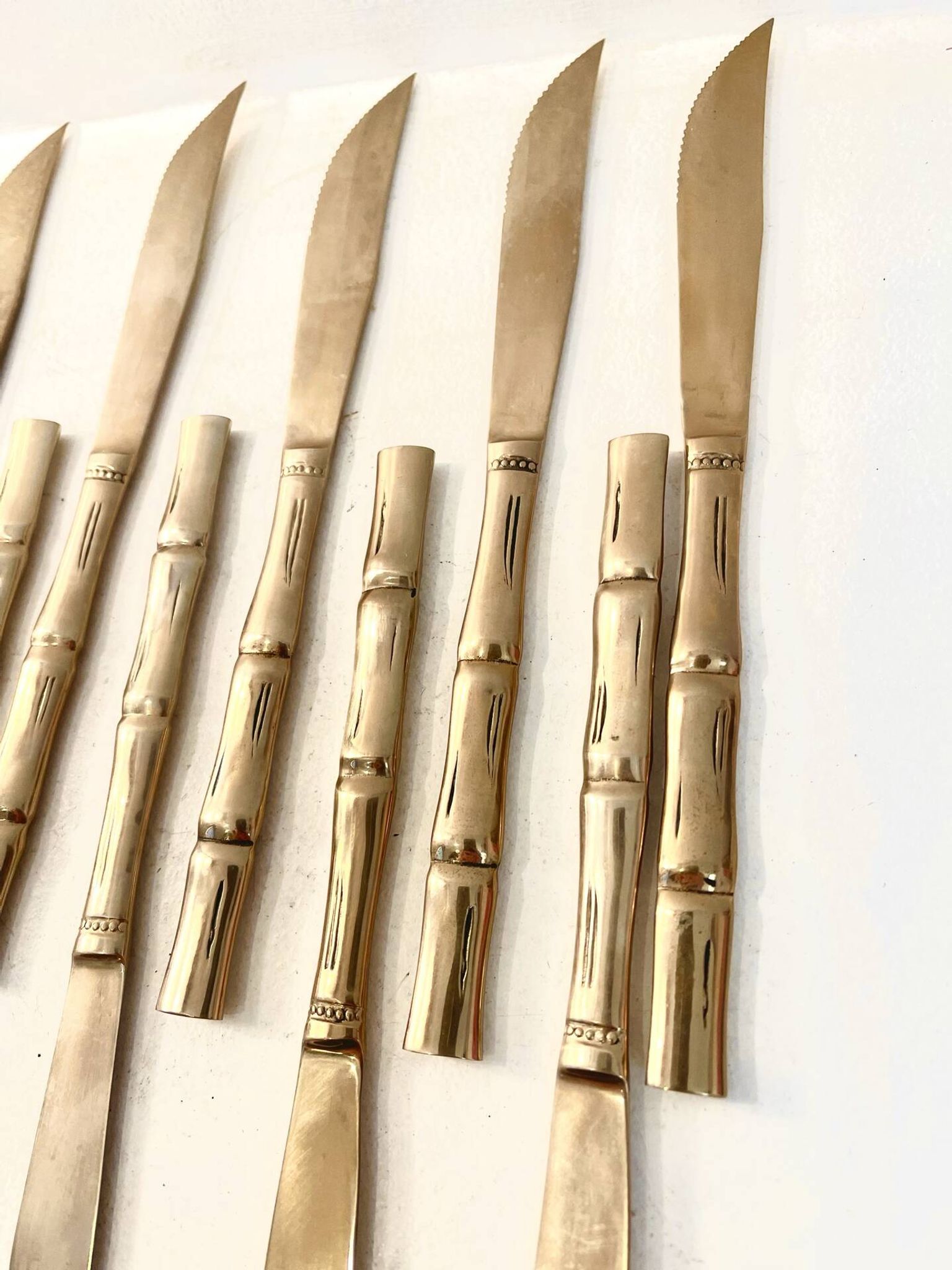 12 gold table knives, Hollywood Regency – circa 1970